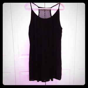 Black dress, spaghetti straps.